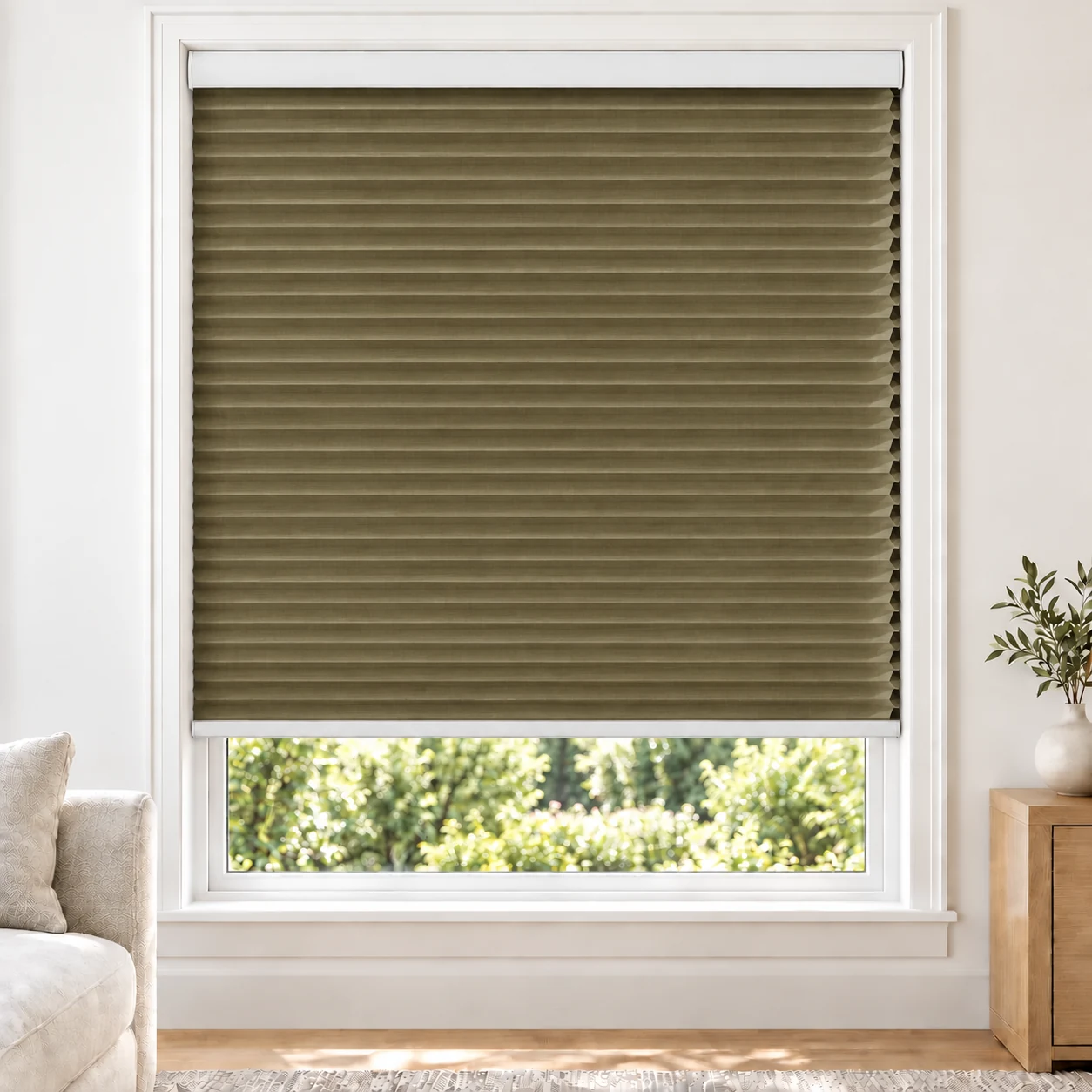 Antique Bronze 25mm honeycomb cellular blind in a bright neutral living room, fabric BTH06, blackout