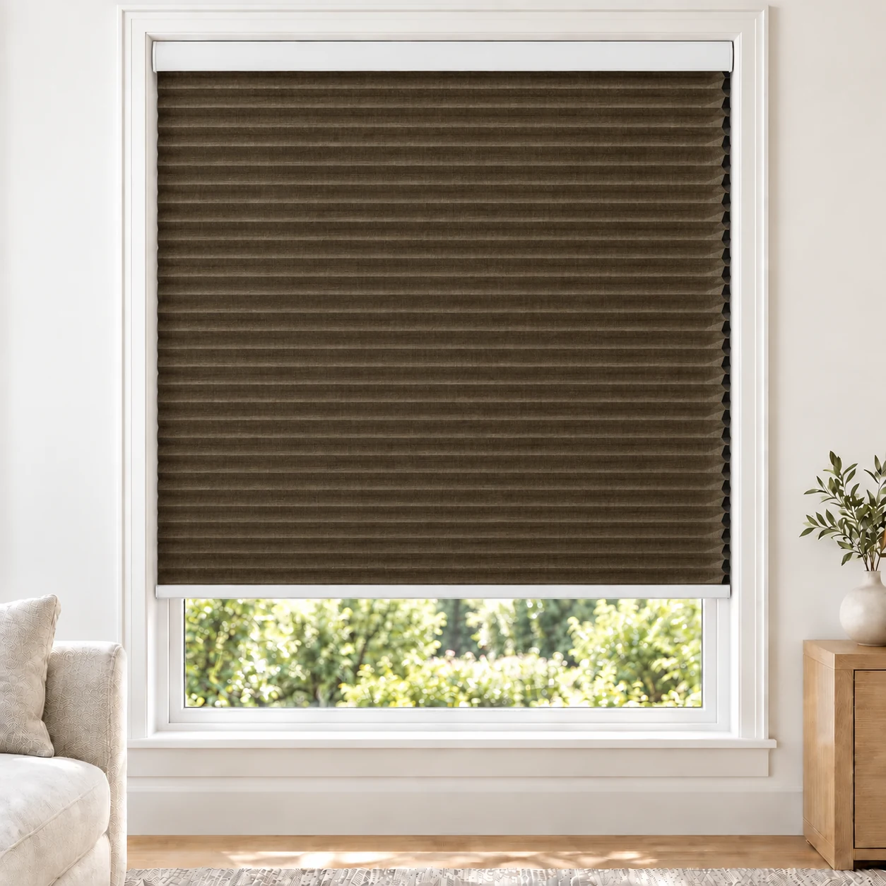 Espresso Weave 25mm honeycomb cellular blind in a bright neutral living room, fabric BYM08, blackout
