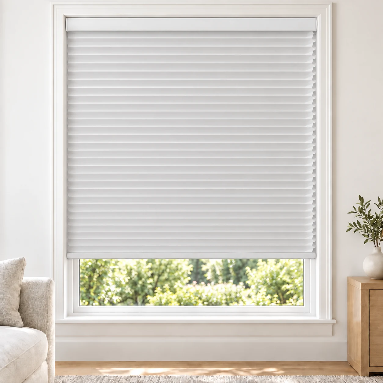Pearl White 25mm honeycomb cellular blind in a bright neutral living room, fabric L01, 70% shading