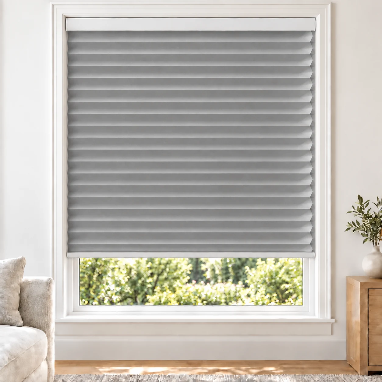 Silver Grey 38mm honeycomb cellular blind in a bright neutral living room, fabric L11-38, 70% shading