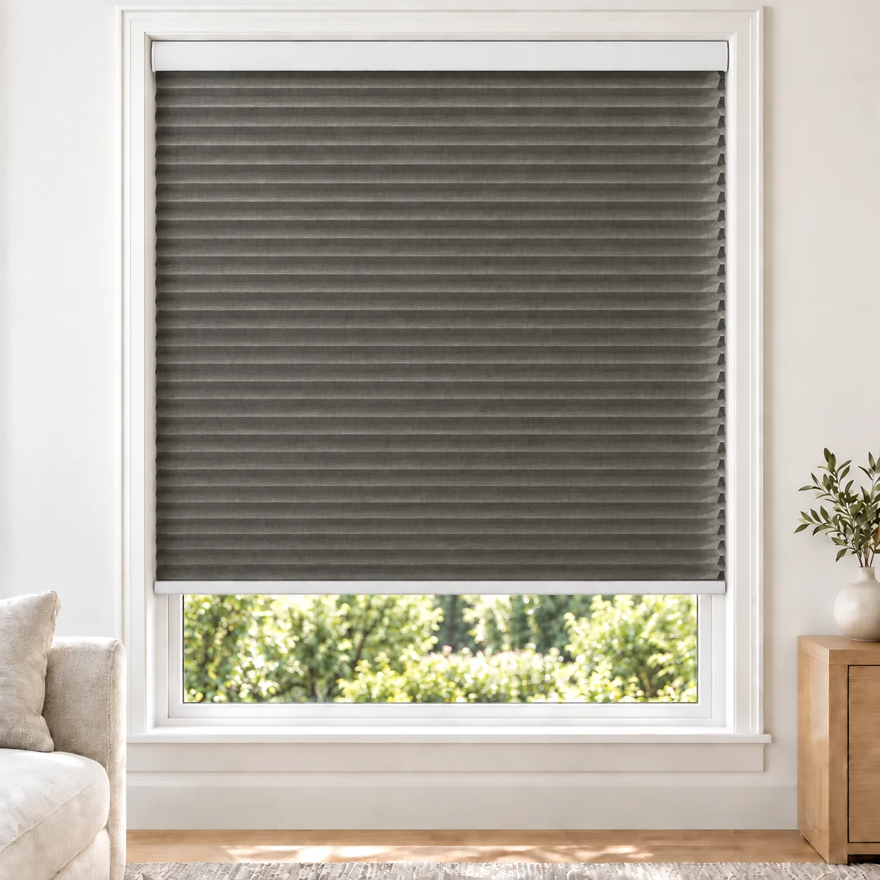 Stone Heather 25mm honeycomb cellular blind in a bright neutral living room, fabric LMF15, 70% shading