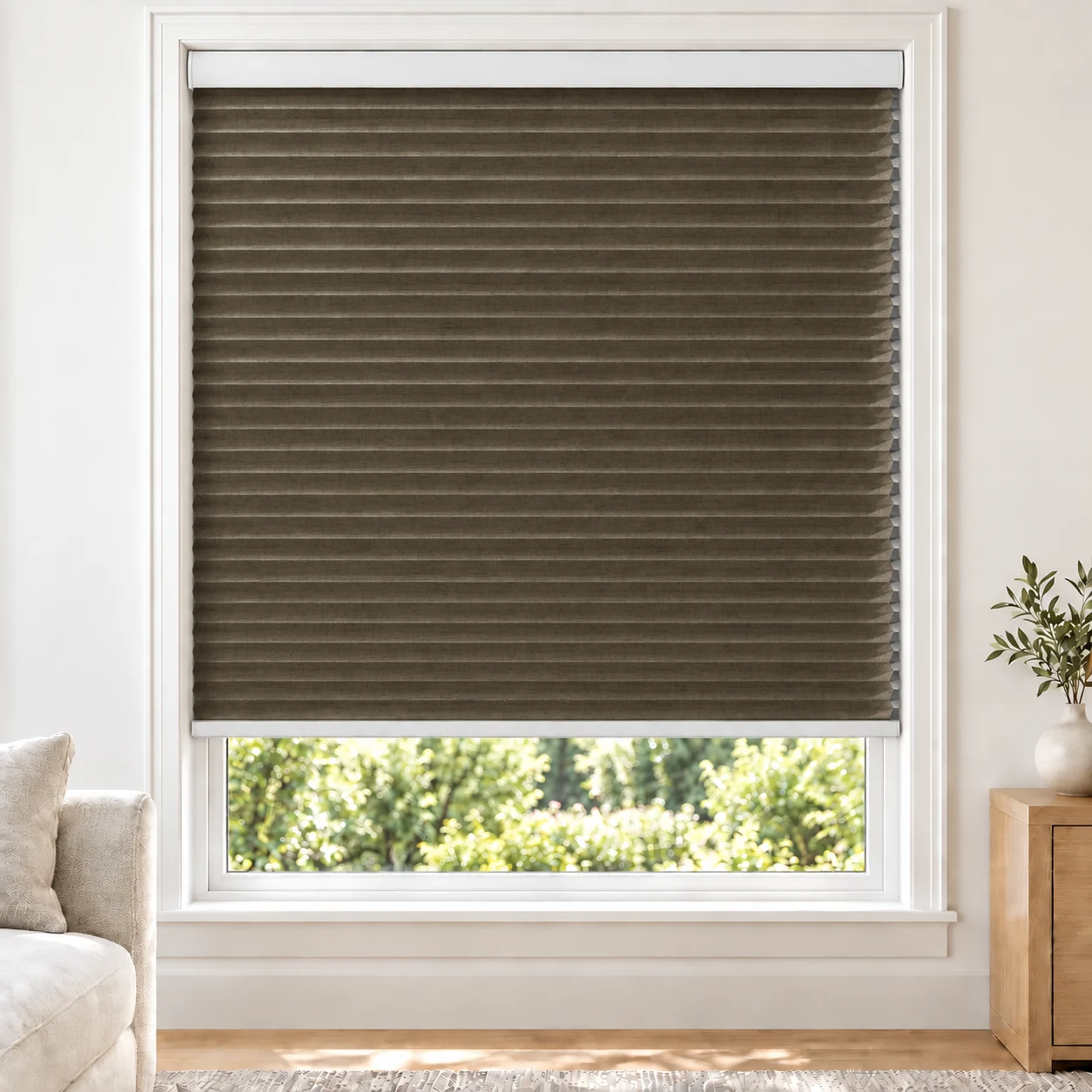 Bronze Heather 25mm honeycomb cellular blind in a bright neutral living room, fabric LMF16, 70% shading