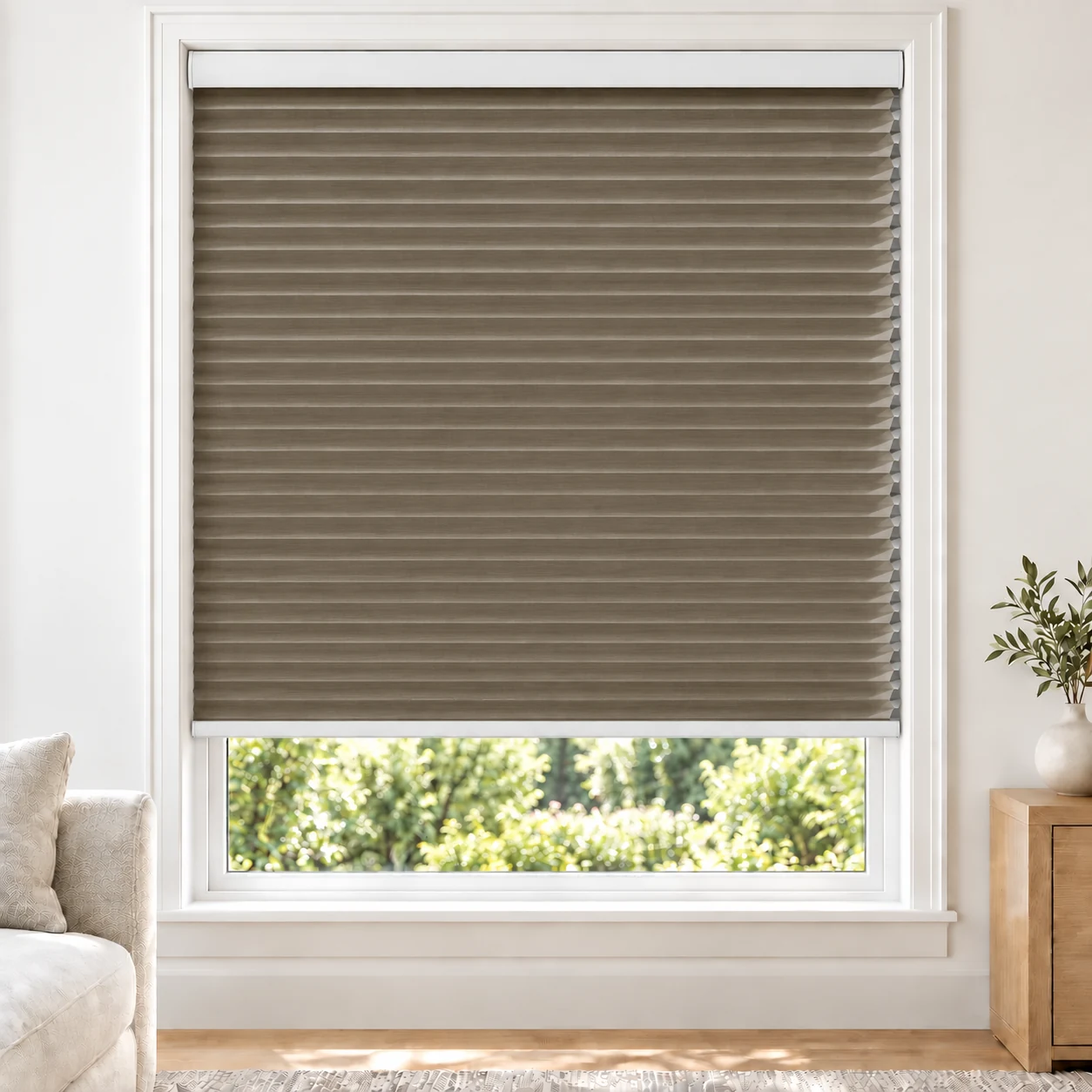 Warm Taupe 25mm honeycomb cellular blind in a bright neutral living room, fabric LTH14, 70% shading