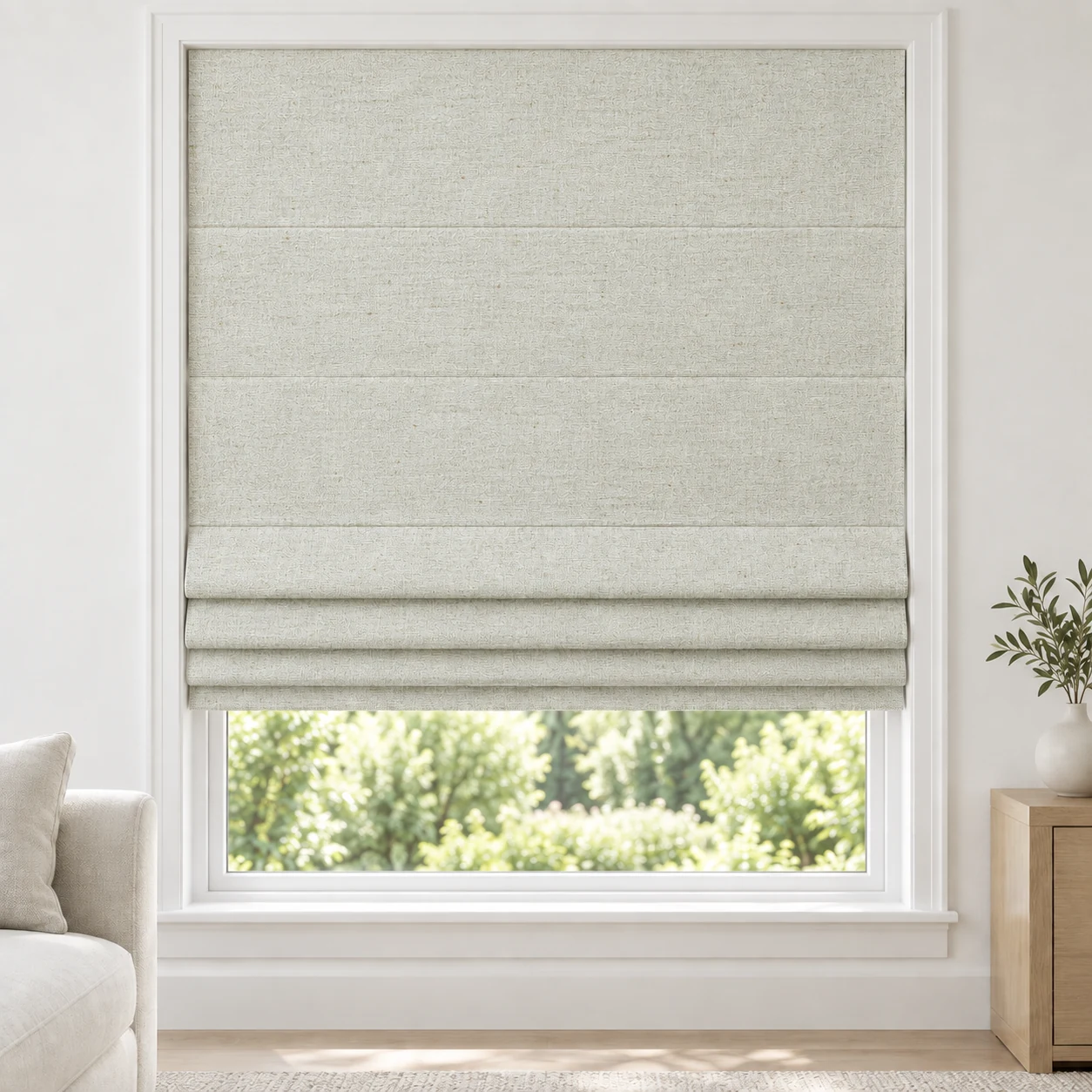 Sage Ivory cordless Roman shade with a softly textured linen-style weave in a styled living room, blackout, fabric BMF18