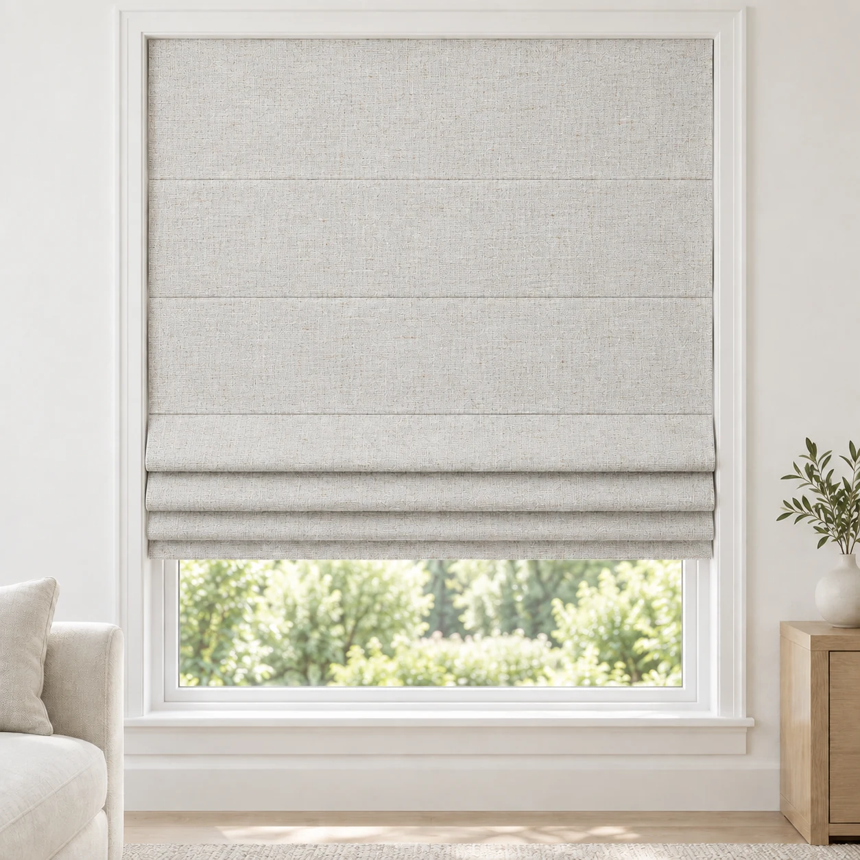 Dove Grey cordless Roman shade with a softly textured linen-style weave in a styled living room, blackout, fabric BMF19