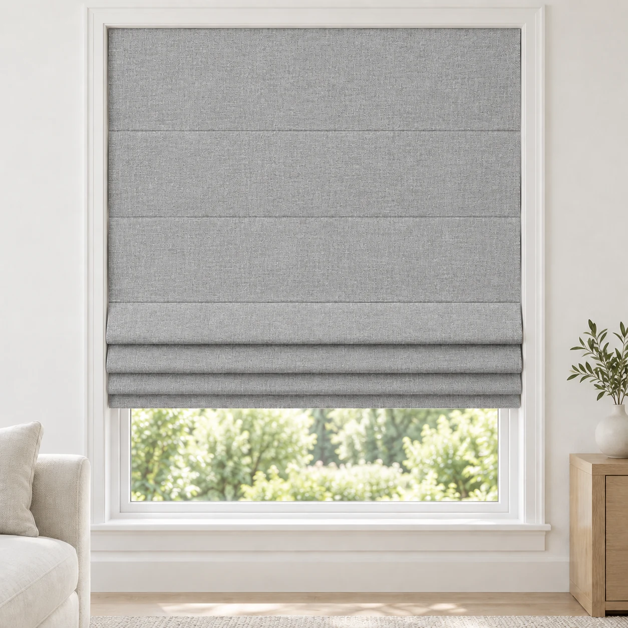 Silver Grey cordless Roman shade with a fine, even linen-style texture in a styled living room, blackout, fabric BSM01