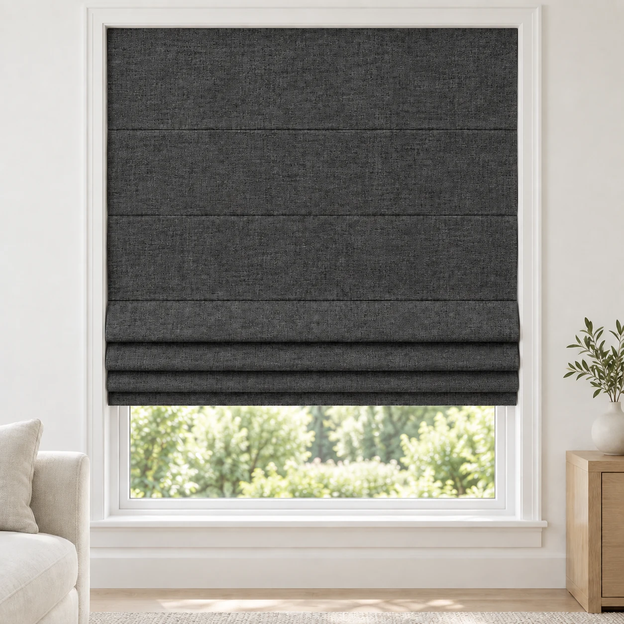 Midnight Charcoal cordless Roman shade with a rich, mottled linen-style texture in a styled living room, blackout, fabric BTM21
