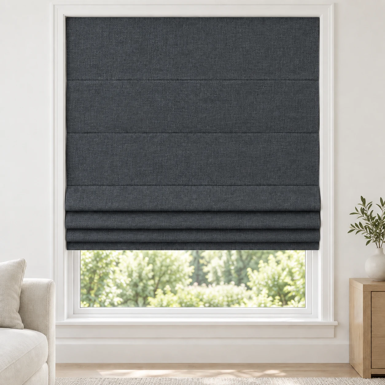 Blue Charcoal cordless Roman shade with a subtle crosswoven texture in a styled living room, blackout, fabric BTW11