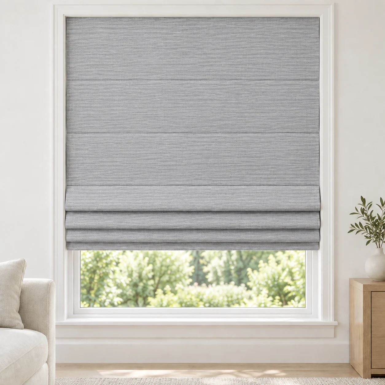 Silver Grey cordless Roman shade with a fine horizontal stripe in a styled living room, light filtering, fabric LMK03