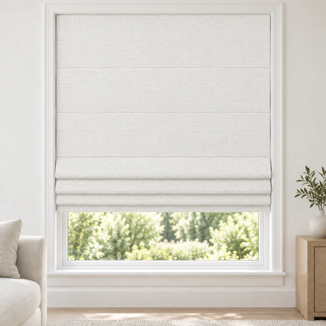 Ivory White cordless Roman shade with an airy, open-weave appearance in a styled living room, light filtering, fabric LMY01