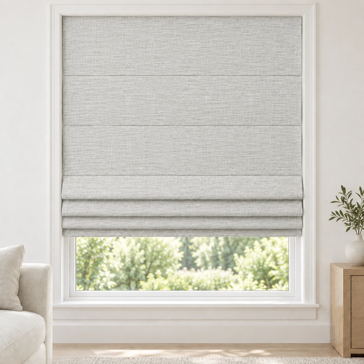 Pale Grey cordless Roman shade with an airy, open-weave appearance in a styled living room, light filtering, fabric LMY03