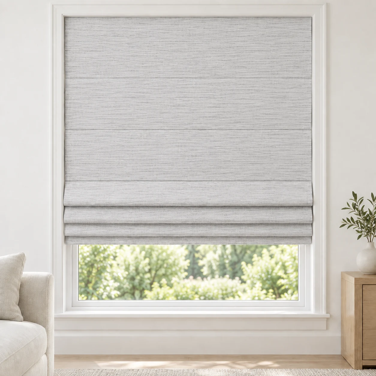 Silver Grey cordless Roman shade with a delicate horizontal stripe in a styled living room, light filtering, fabric LYU03