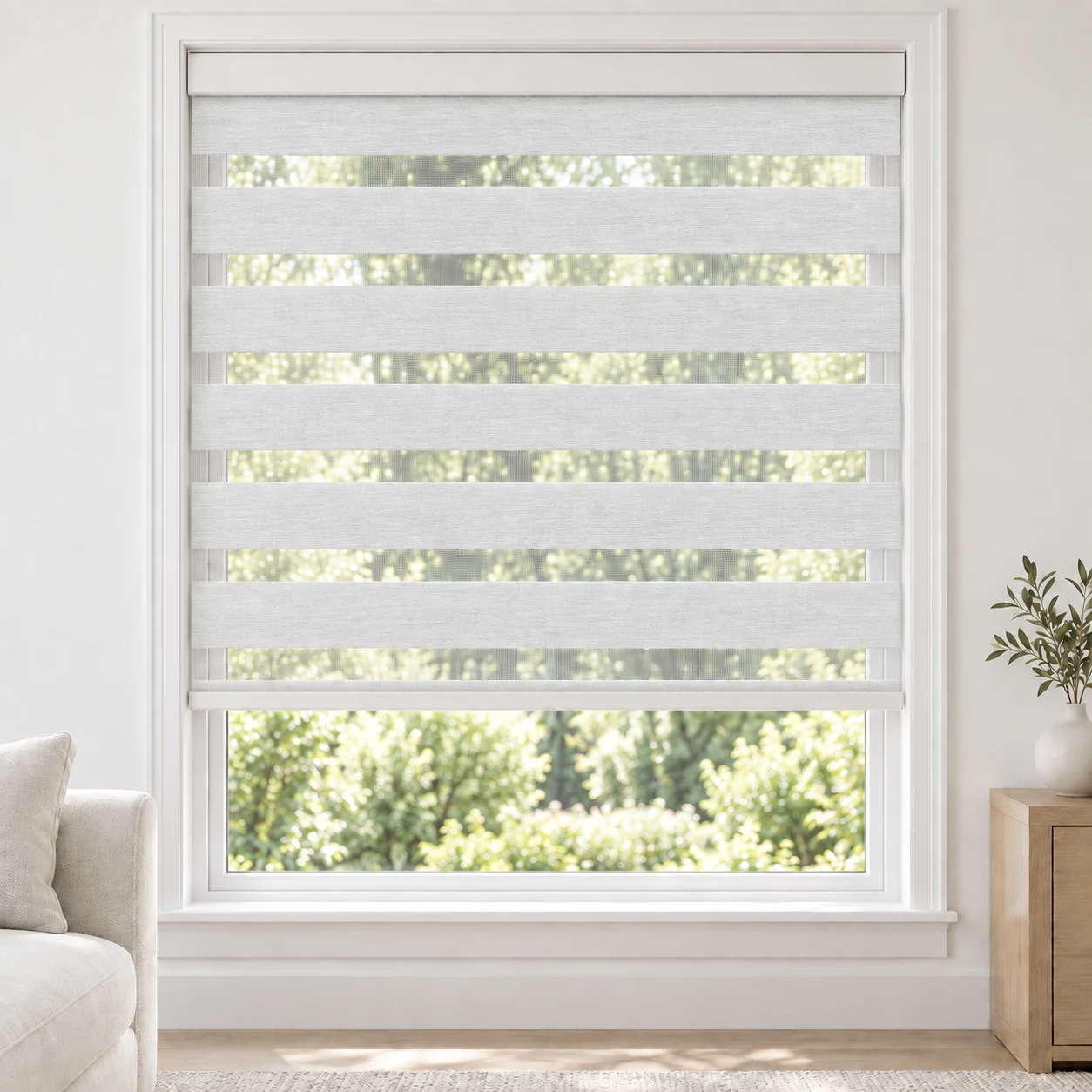 Frost White cordless zebra blind in a living room, fabric FWB01