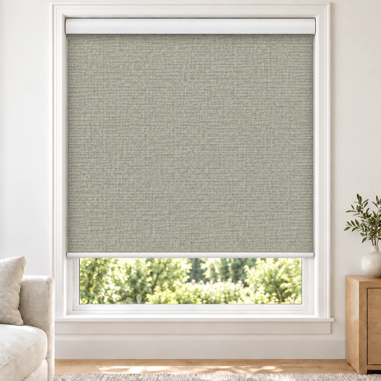 Mist Grey ADORO standard roller blind in a bright living room, blackout, fabric ADORO-LIGHTGREY-BO