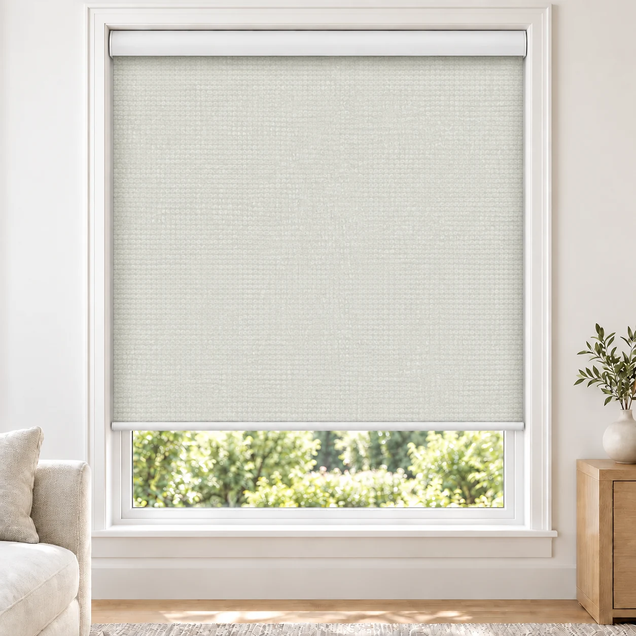 Ice White ADORO standard roller blind in a bright living room, light filtering, fabric ADORO-WHITEICE-LF