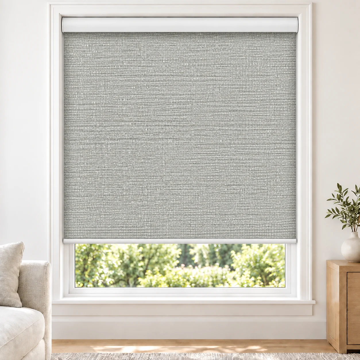 Silver Grey GRACE standard roller blind in a bright living room, light filtering, fabric Grace-Silver-LF
