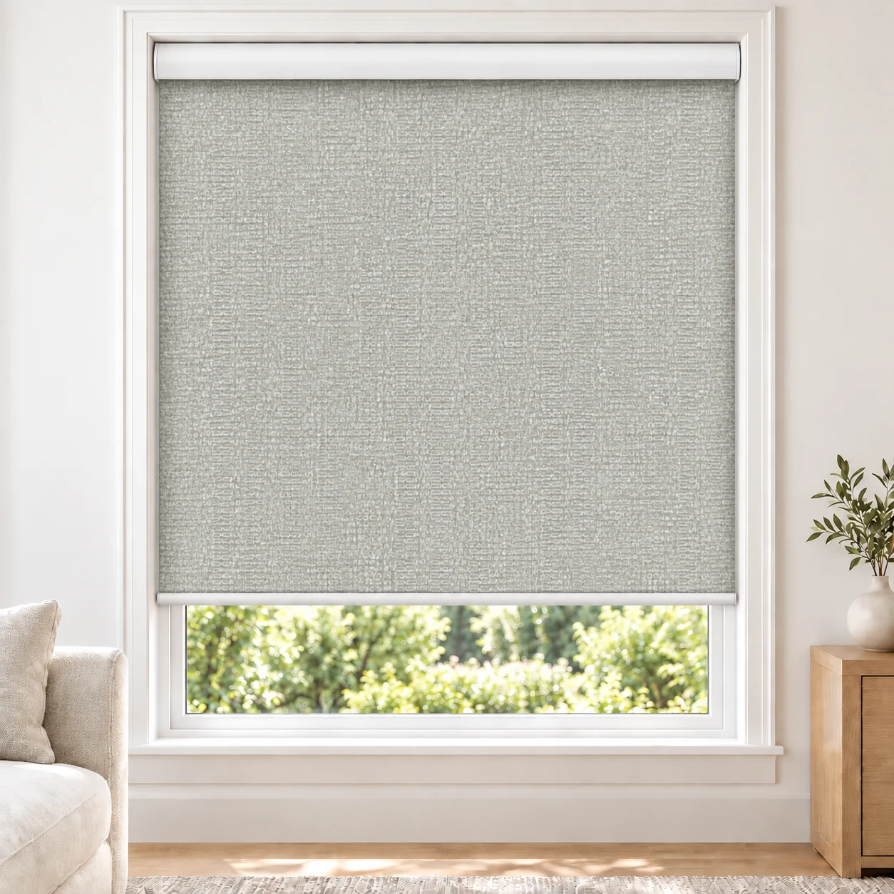 Silver Grey GRACELUNA standard roller blind in a bright living room, blackout, fabric GraceLuna-Silver-BO