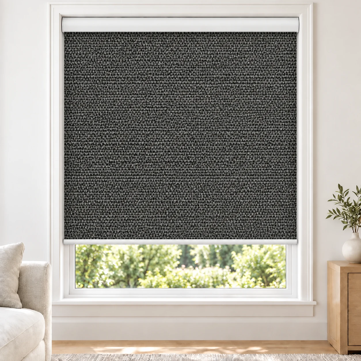 Onyx Black OMEGA1PCT standard roller blind in a bright living room, light filtering, fabric OMEGA1PCT-BLACK