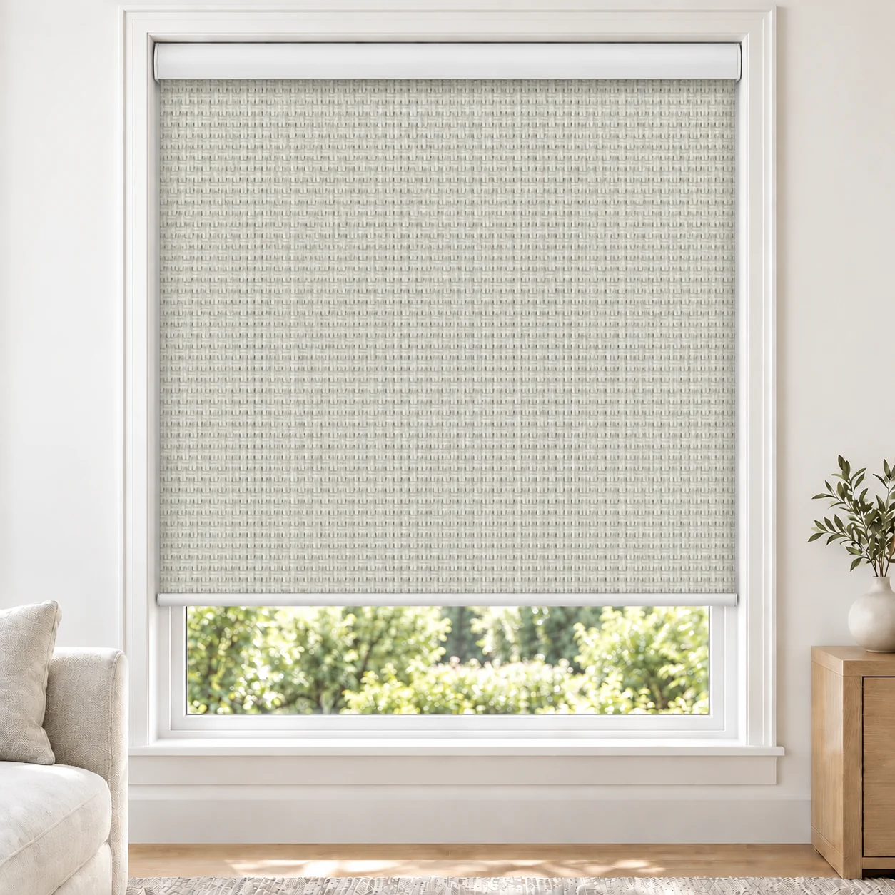 Soft White OMEGA1PCT standard roller blind in a bright living room, light filtering, fabric OMEGA1PCT-WHITE