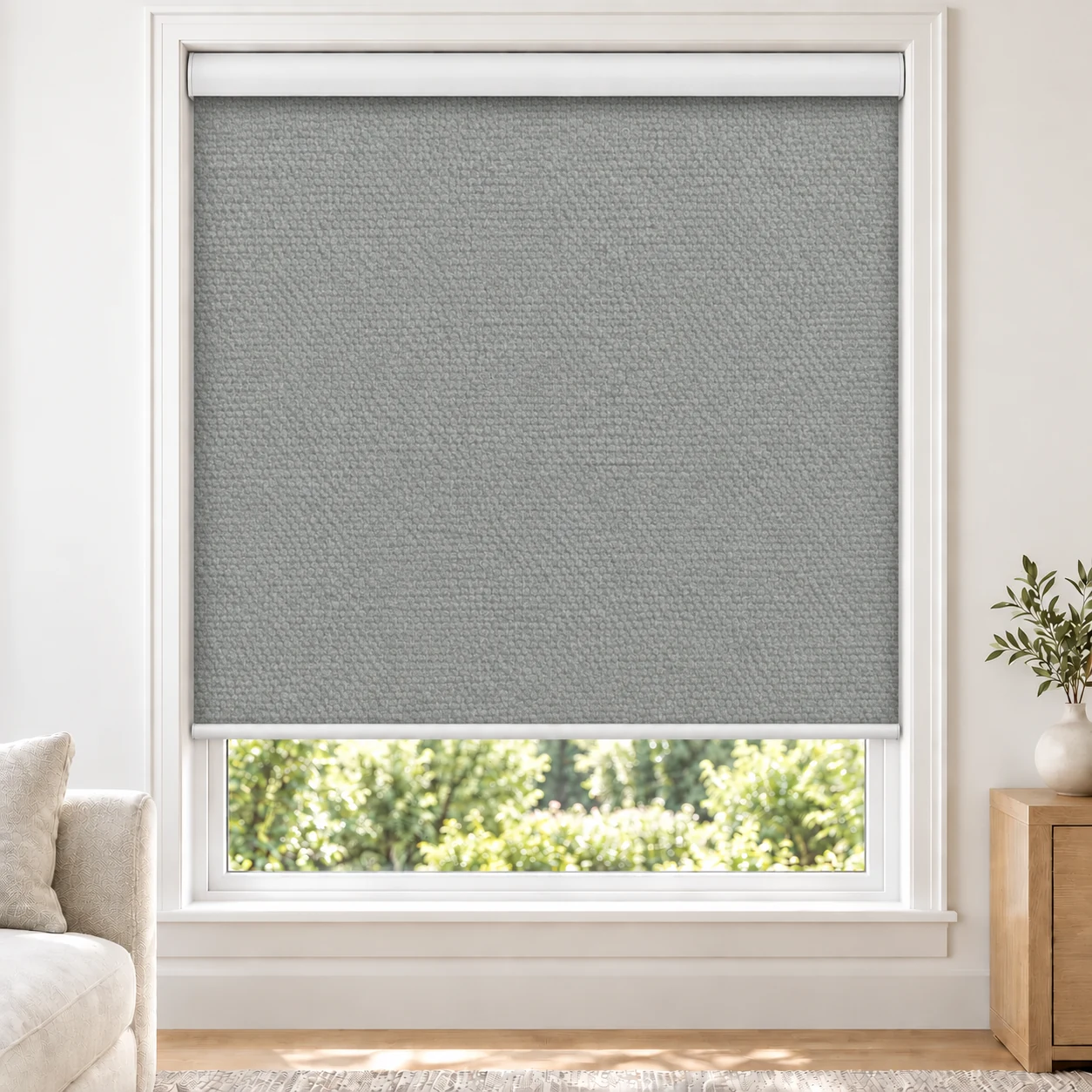 Stone Grey PRIME standard roller blind in a bright living room, blackout, fabric PRIME-GRAY-BO