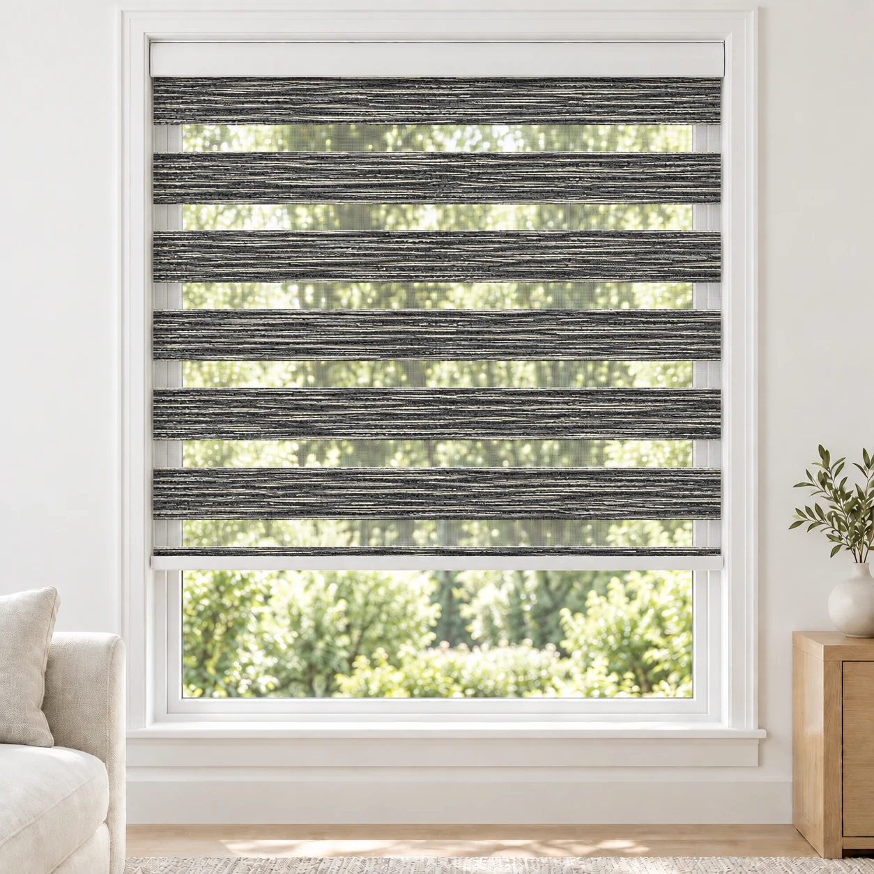 Charcoal AQUAWIDE4 standard zebra blind with alternating fabric and sheer bands in a bright living room, AQUAWIDE4-CHARCOAL-LF