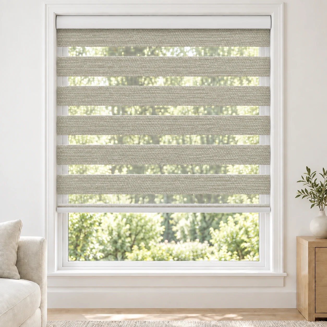 Warm Ivory AQUAWIDE4 standard zebra blind with alternating fabric and sheer bands in a bright living room, AQUAWIDE4-IVORY-LF