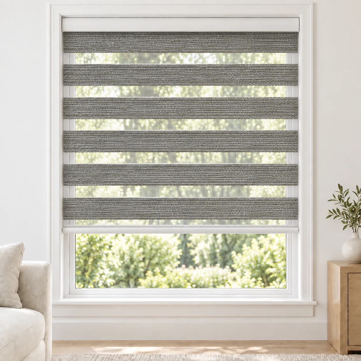 Mist Grey Bagoda standard zebra blind with alternating fabric and sheer bands in a bright living room, Bagoda-Light-Grey-DO
