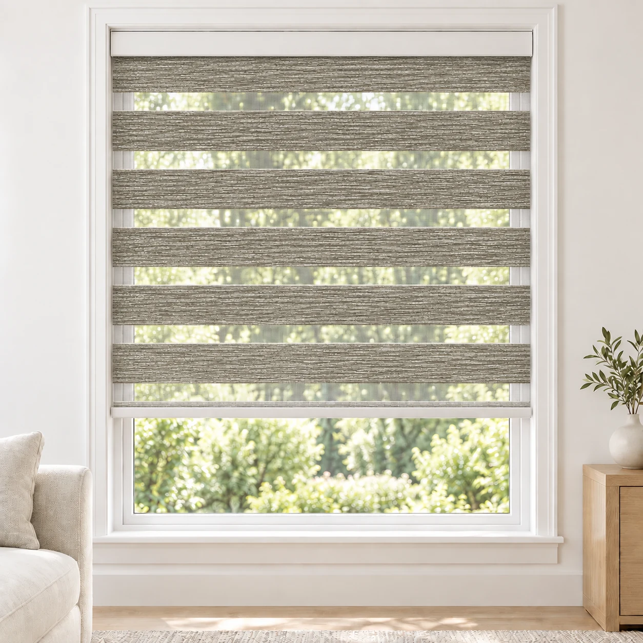Stone Grey Bella standard zebra blind with alternating fabric and sheer bands in a bright living room, Bella-Grey-LF
