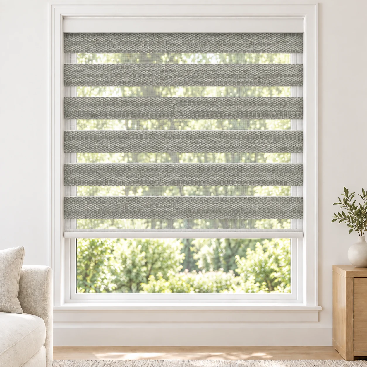 Soft White Bilford standard zebra blind with alternating fabric and sheer bands in a bright living room, Bilford-White-DO