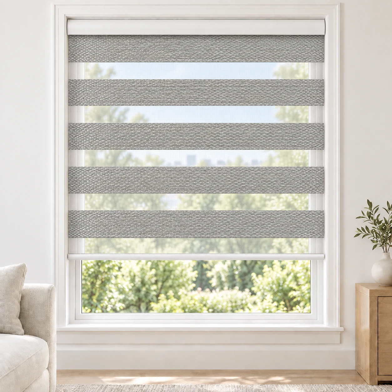Mist Grey Blegance standard zebra blind with alternating fabric and sheer bands in a bright living room, Blegance-Light-grey-DO