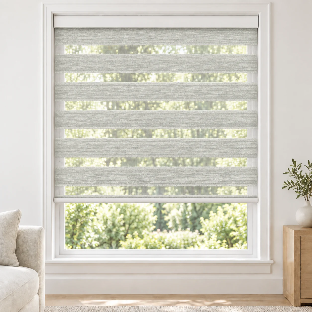 Soft White Blegance standard zebra blind with alternating fabric and sheer bands in a bright living room, Blegance-White-DO