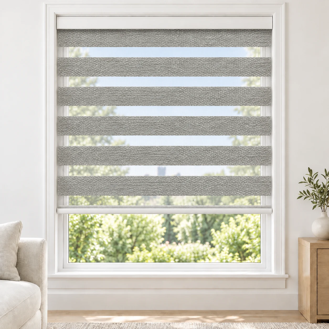 Silver Grey Doly standard zebra blind with alternating fabric and sheer bands in a bright living room, Doly-Silver-DO