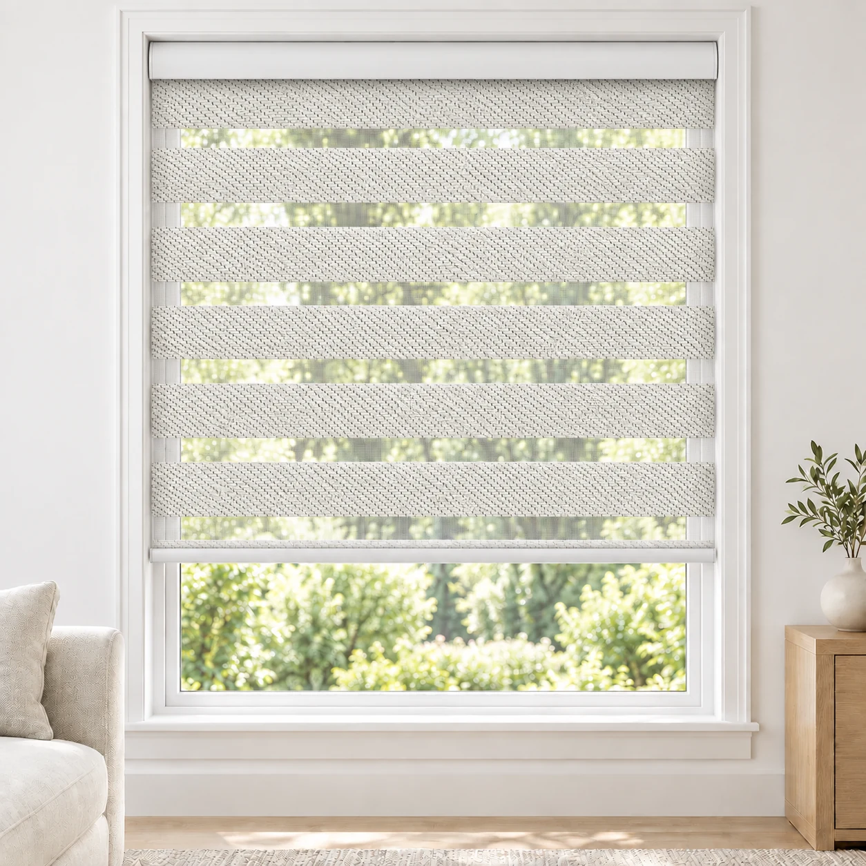 Soft White FARO standard zebra blind with alternating fabric and sheer bands in a bright living room, FARO-WHITE-BO