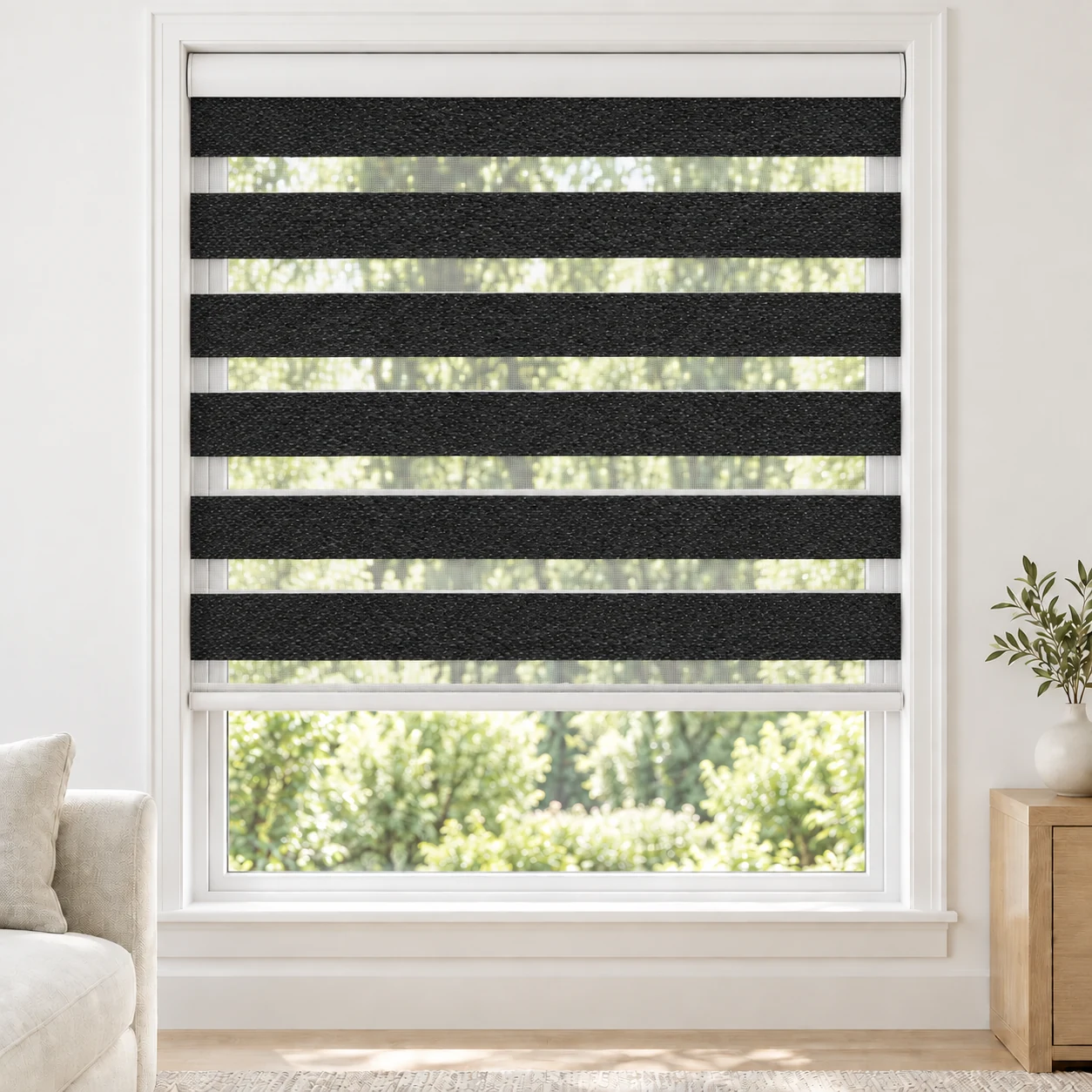 Onyx Black LANA standard zebra blind with alternating fabric and sheer bands in a bright living room, LANA-BLACK-LF