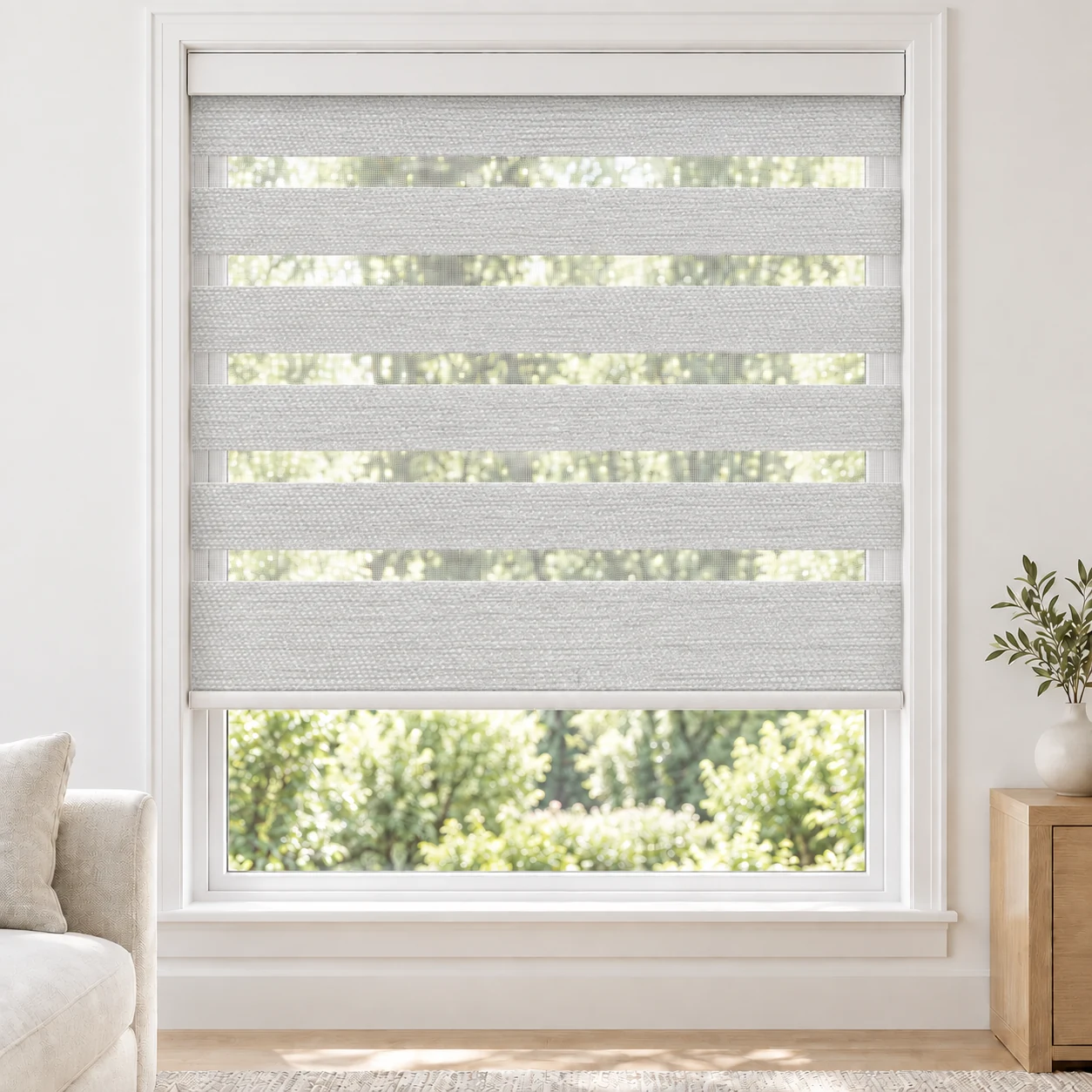 Soft White Lara standard zebra blind with alternating fabric and sheer bands in a bright living room, Lara-White-LF
