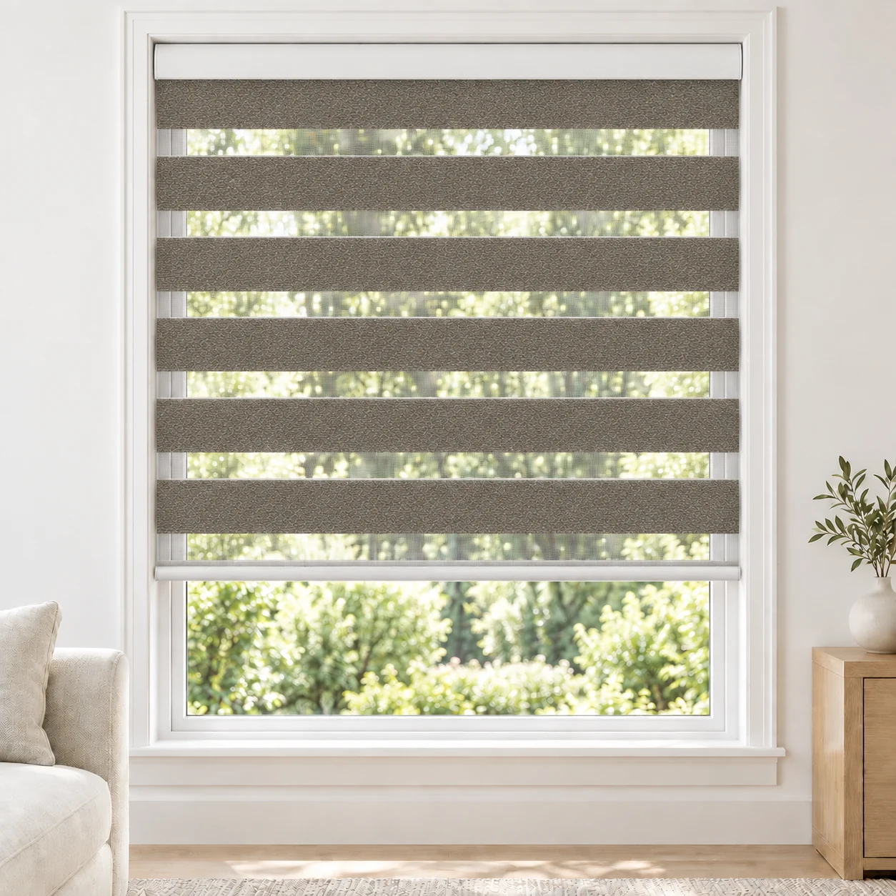 Stone Grey LUCCA1TONE standard zebra blind with alternating fabric and sheer bands in a bright living room, LUCCA1TONE-GRAY-LF