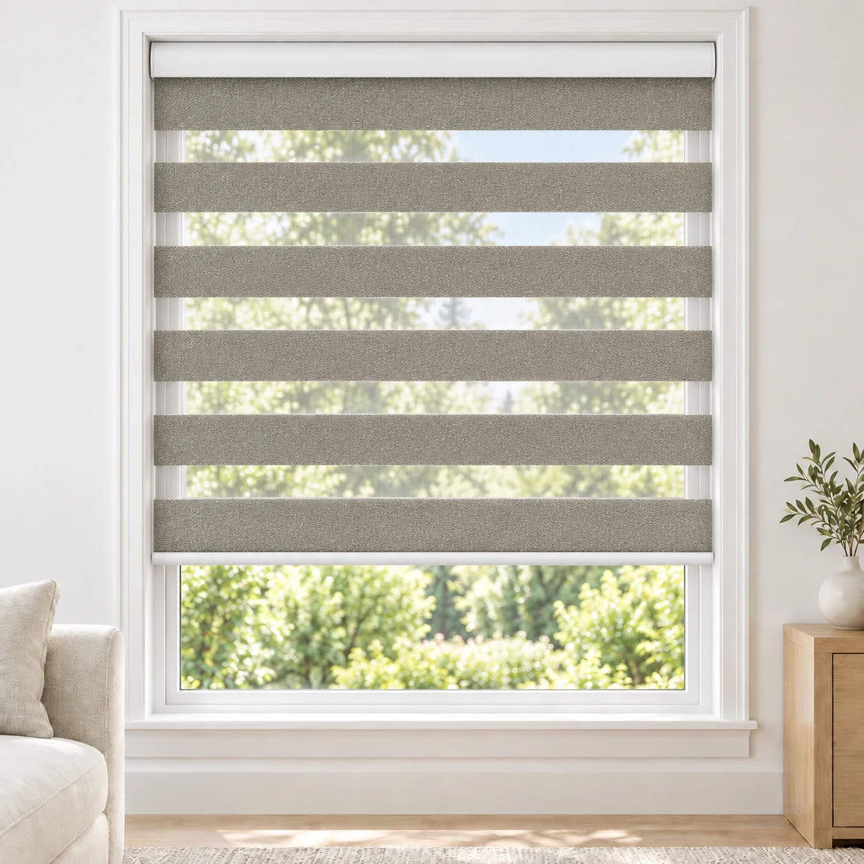 Mist Grey LUCCA1TONE standard zebra blind with alternating fabric and sheer bands in a bright living room, LUCCA1TONE-LGRAY-LF