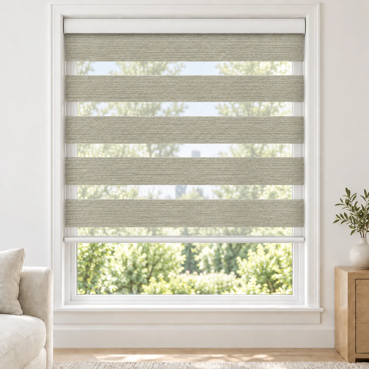 Silver Grey PARDA standard zebra blind with alternating fabric and sheer bands in a bright living room, PARDA-SLIVER-LF