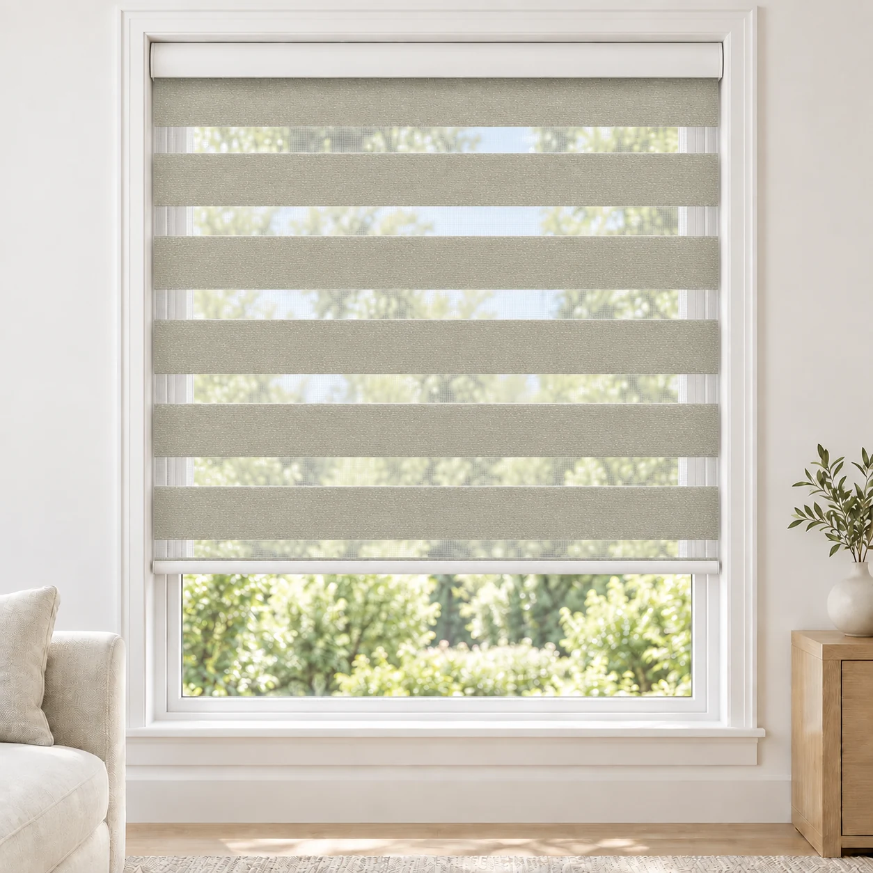 Warm Ivory PEACEWIDE standard zebra blind with alternating fabric and sheer bands in a bright living room, PEACEWIDE-IVORY-LF