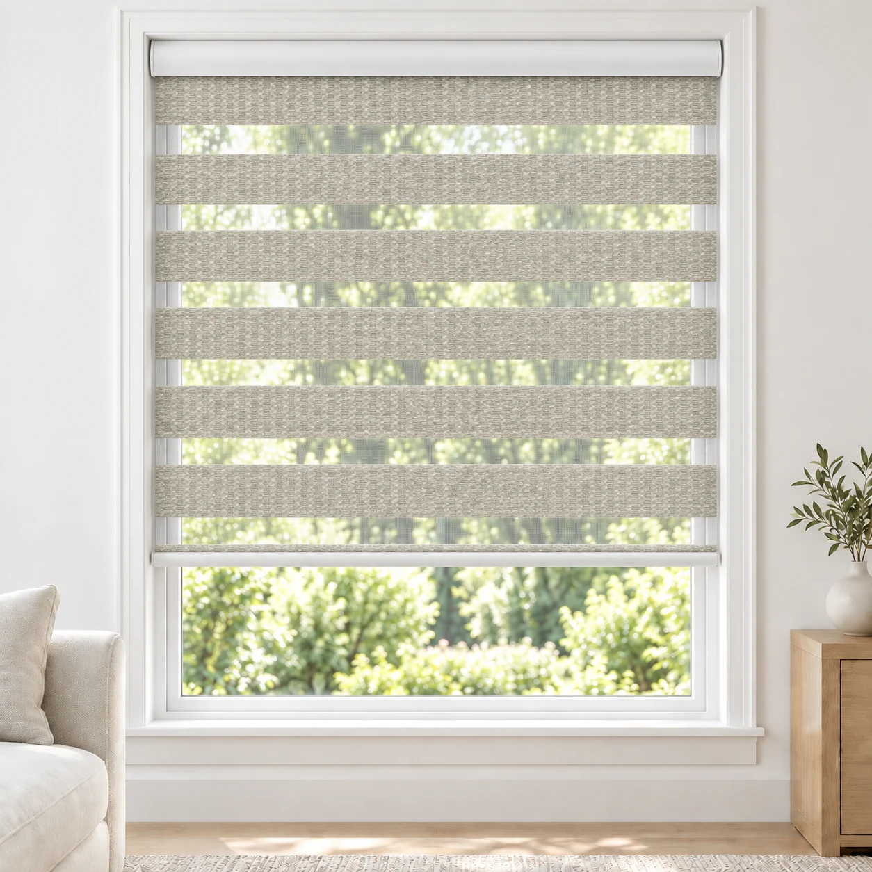 Soft White PRADO standard zebra blind with alternating fabric and sheer bands in a bright living room, PRADO-WHITE-LF