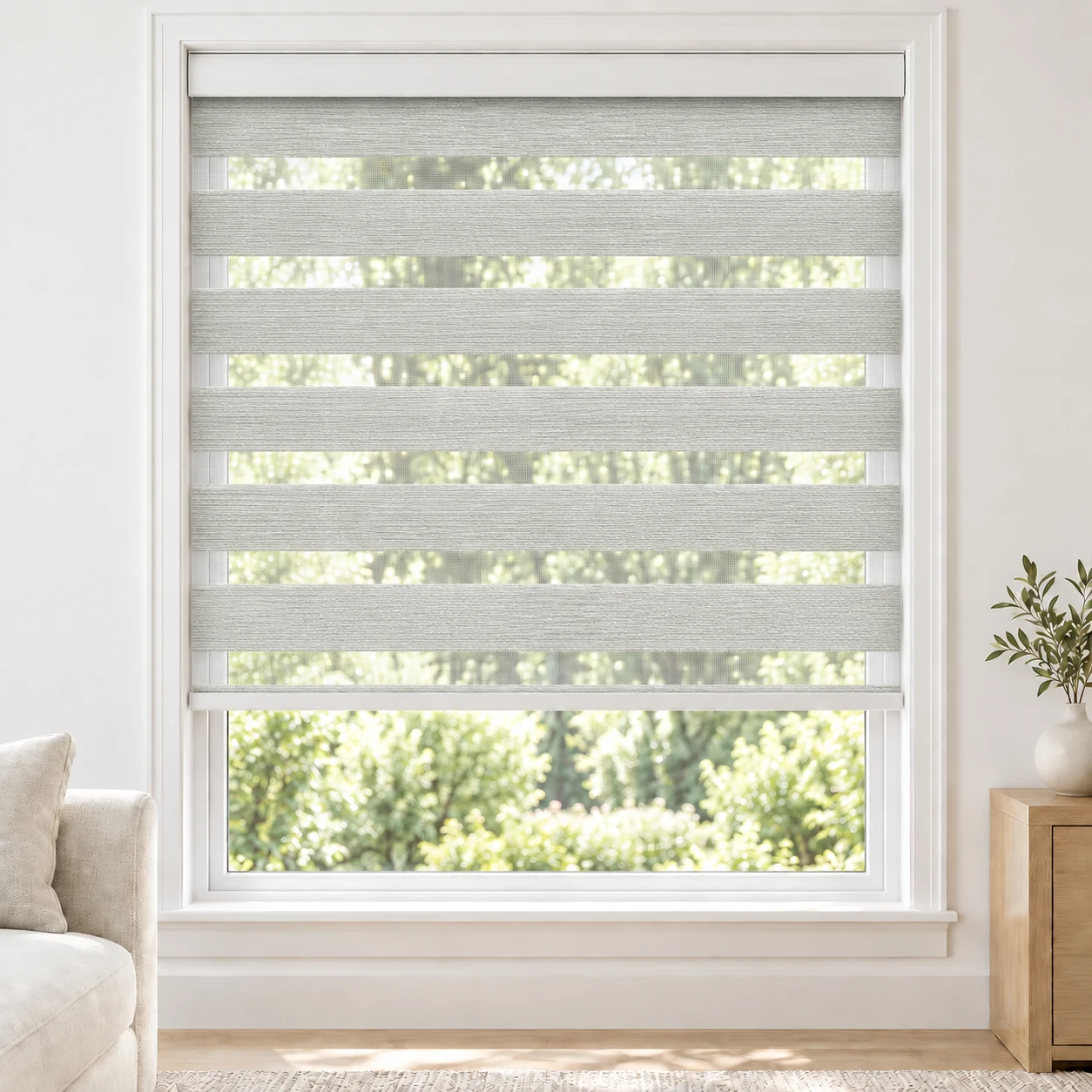 Pure White ROSELLE standard zebra blind with alternating fabric and sheer bands in a bright living room, ROSELLE-PUREWHITE-BO