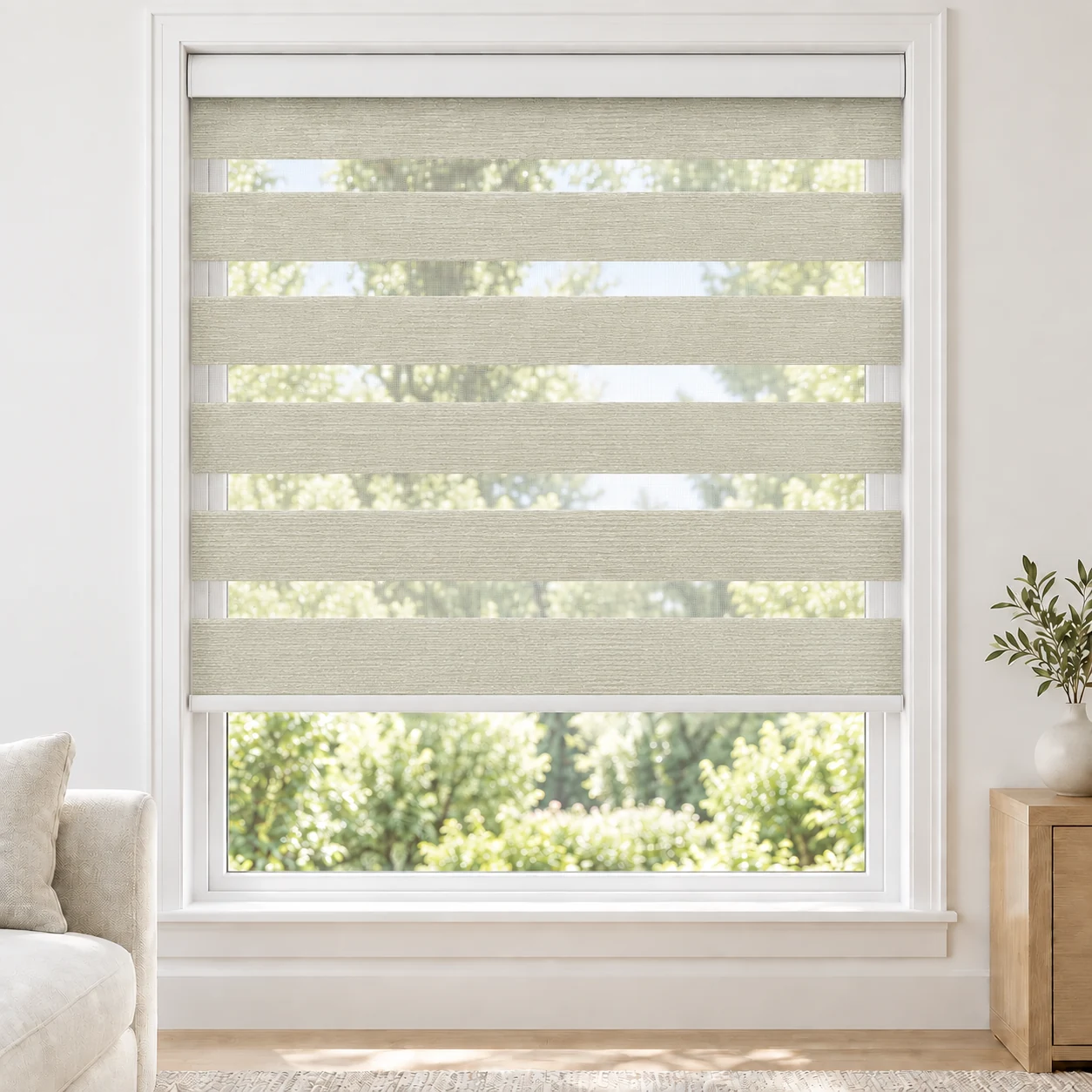 Warm Ivory VIENNAWIDE standard zebra blind with alternating fabric and sheer bands in a bright living room, VIENNAWIDE-IVORY-LF